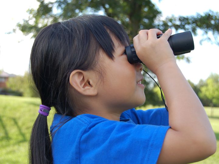 a child birdwatching during a family volunteer vacation citizen science project