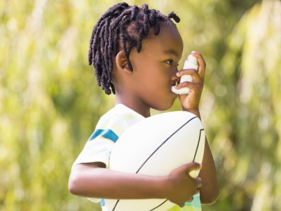 Child using an inhaler outdoors