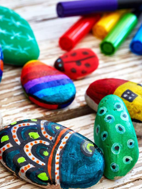 Colored rocks and chalk on a table