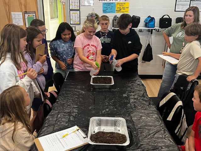 Students from Free Home Elementary take part in an environmental science project