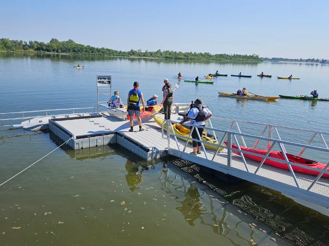 People loading boarding kayaks from an adaptive water access platform. Mississippi River Water Trail, Mississippi River Water Trail Association