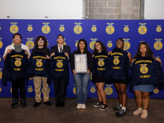 McCaskey High School students stand with their Future Farmers of America Chapter jackets