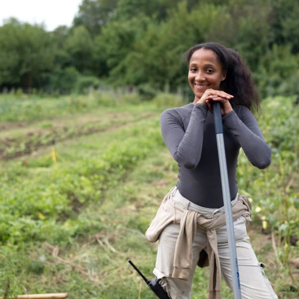 A young woman standing in a field