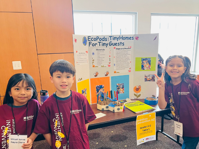 Students in front of a science fair project