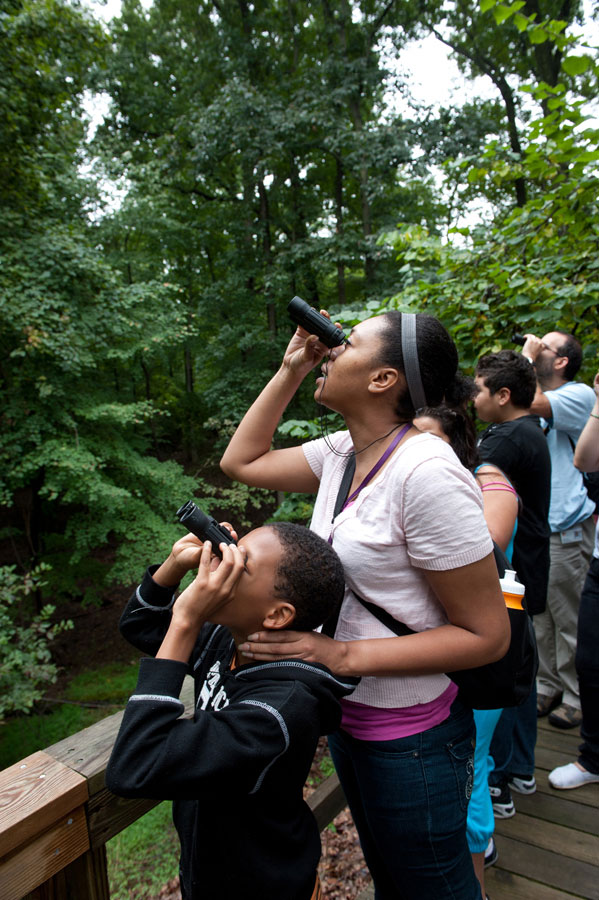 Mom and son using binoculars at Rock Creek Park