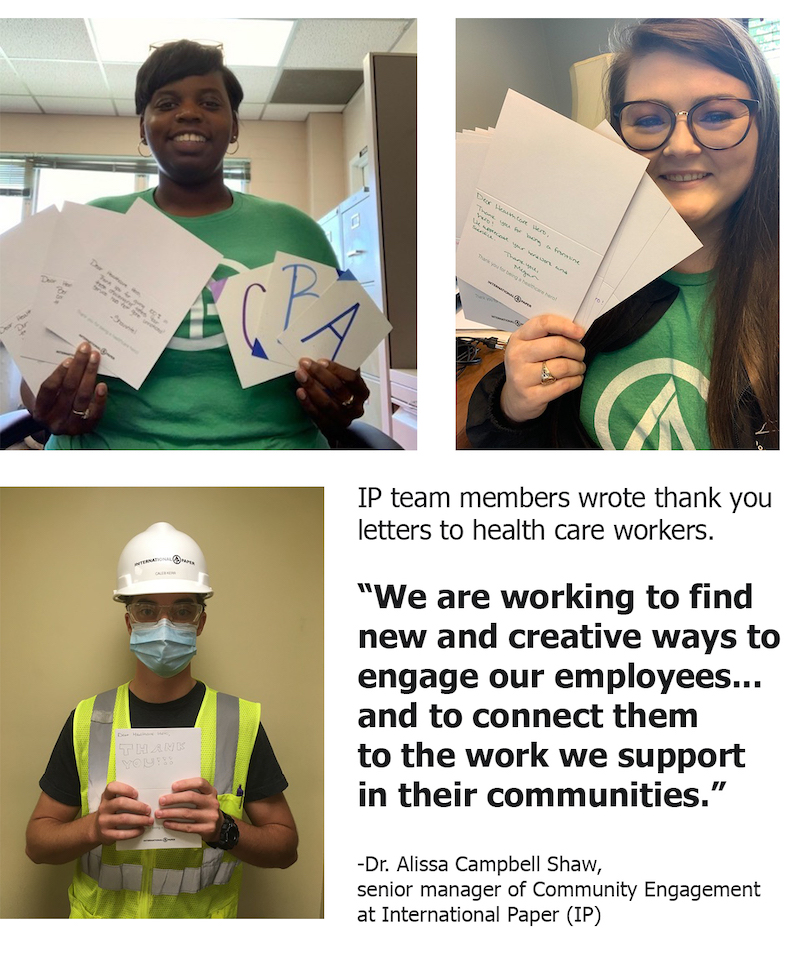International Paper staff volunteers hold up thank you letters to health care workers