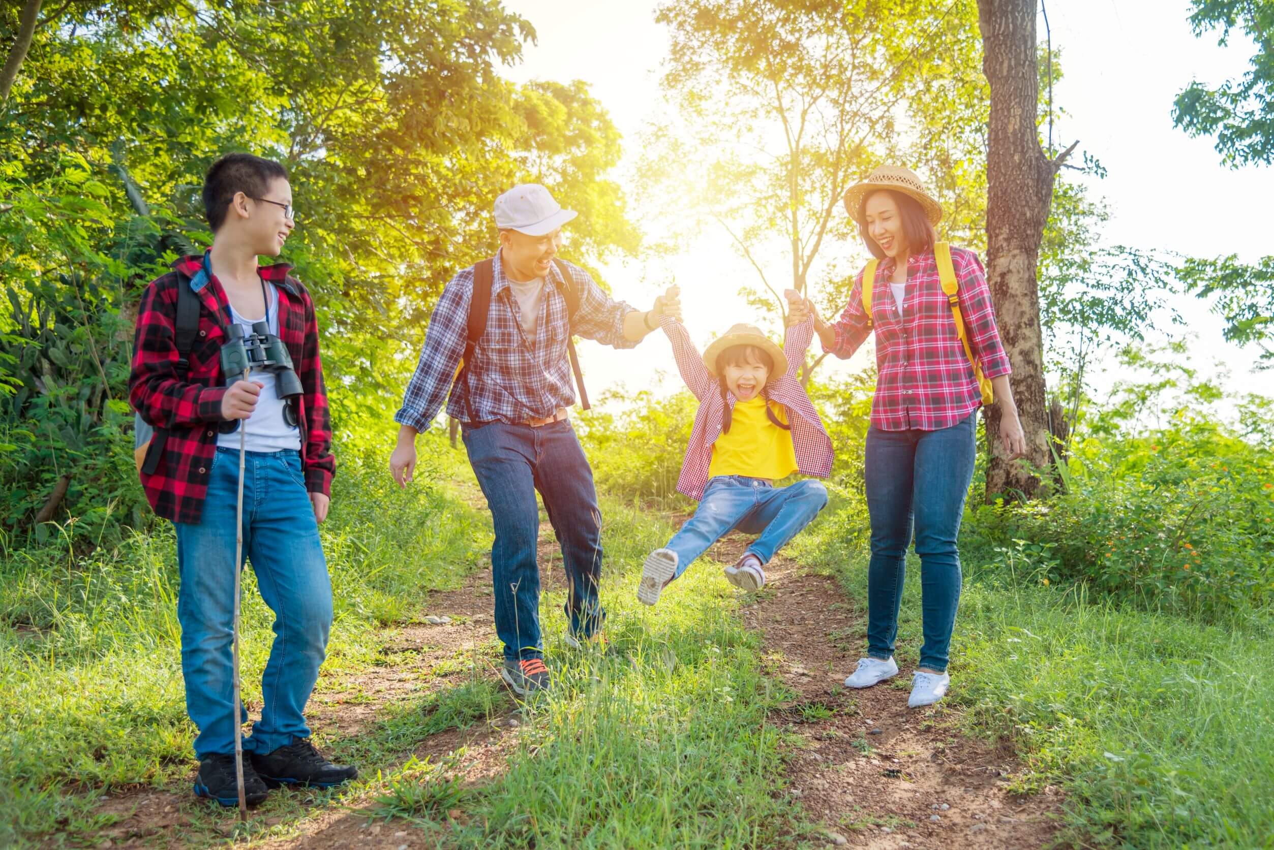 family hiking with kids while playing games and having fun