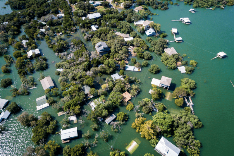 aerial view of flooded areas with homes underwater