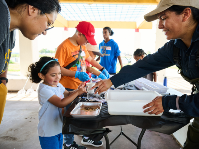 Young girl near a water sampling tray