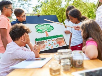 students outside learning about environmental education