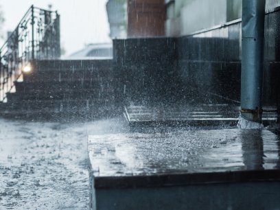 Rainwater flowing from downspout