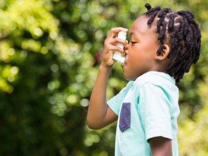 Kid using inhaler outside