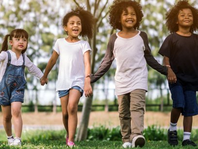 Children walking through a park