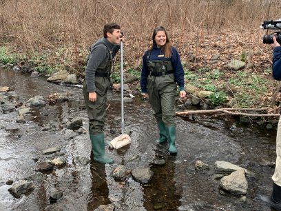 Videographer filming students at the Teaneck Creek Conservancy