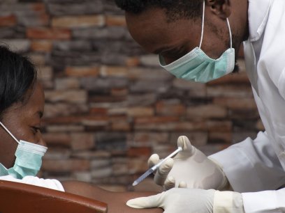 Doctor giving patient a vaccine