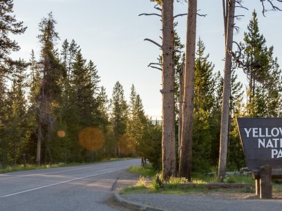 Entrance to Yellowstone National Park with a National Park sign