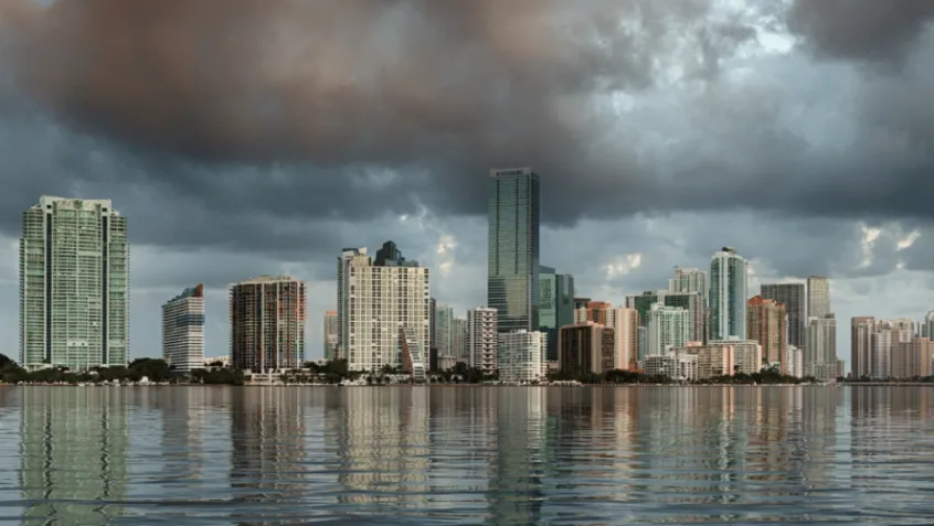 Dawn view of Miami Skyline reflected in water