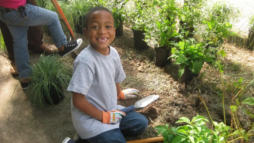 Kid volunteer at an NPLD event