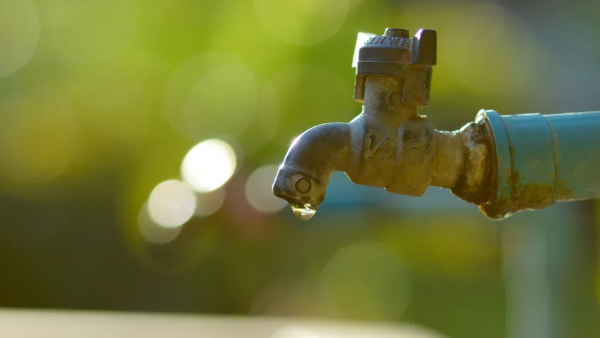 Wasting water in a drought, dripping faucet