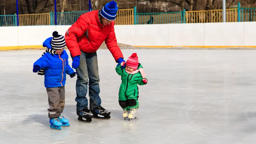 Dad skating with his kids