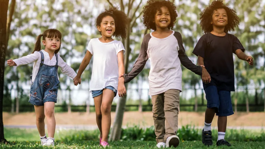 Children walking through a park