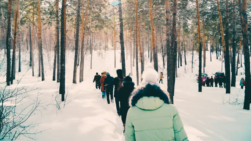 Researchers walking through the snow