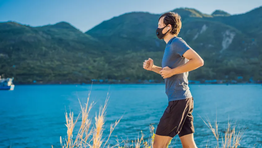 Man running with a mask on