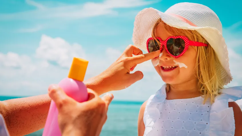 Child using sunblock