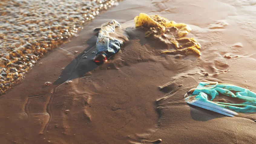 banner with masks on the beach