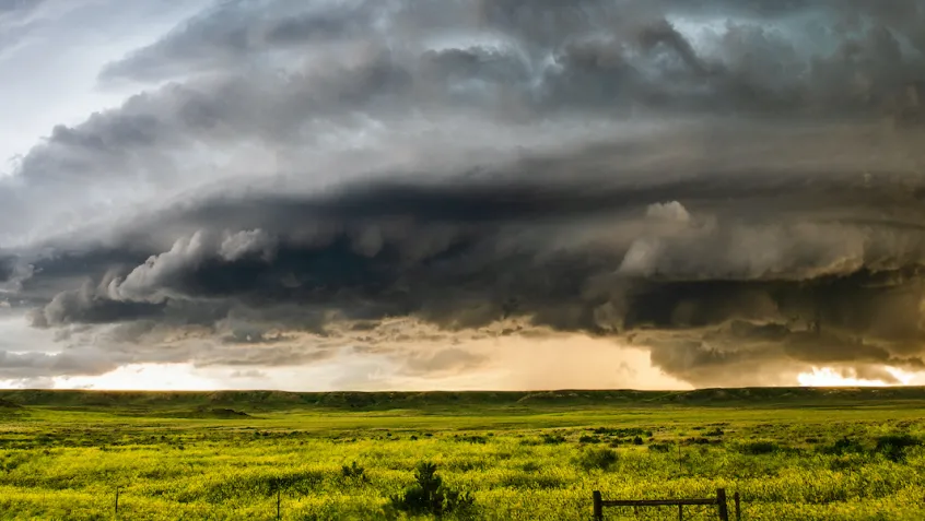 ominous weather cloud over a field