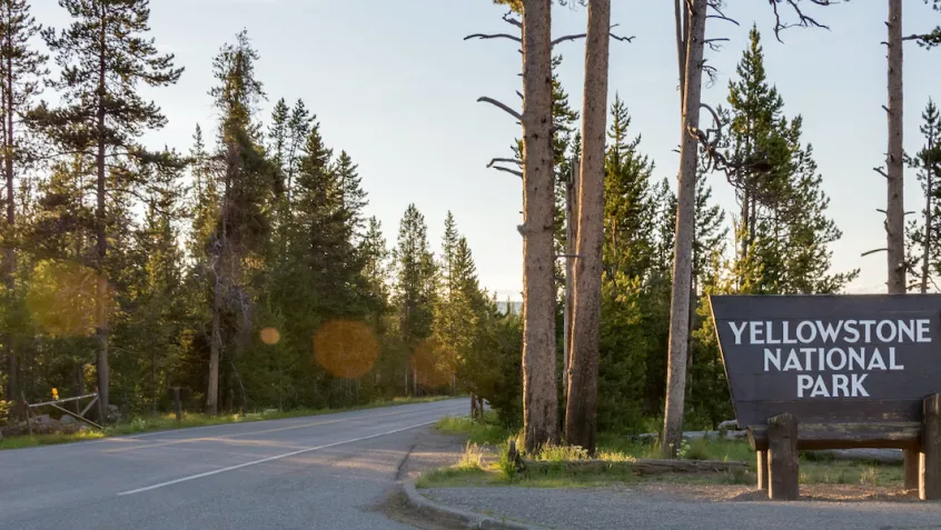 Entrance to Yellowstone National Park with a National Park sign