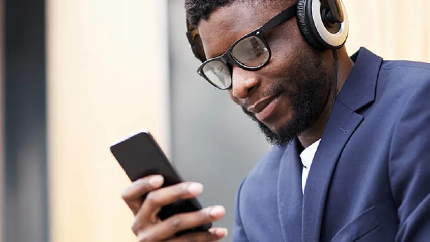 Young man listening to headphones