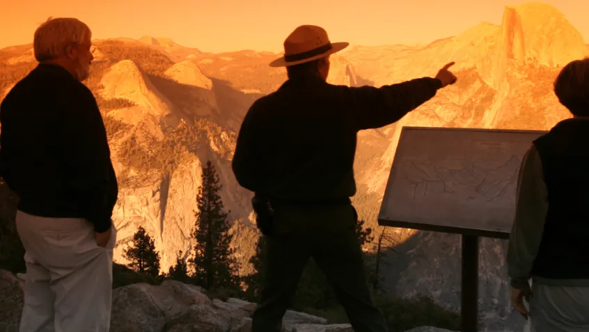 Park ranger explaining landscape to visitors