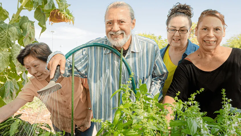group of seniors working in community garden