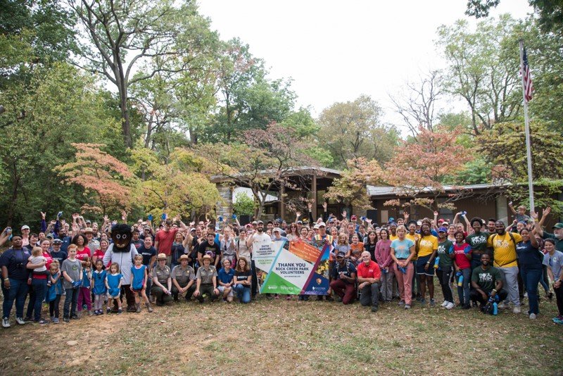 a group of volunteers stands together for a photo after a successful National Public Lands Day event