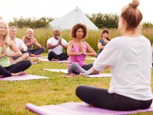 a group does yoga in the outdoors