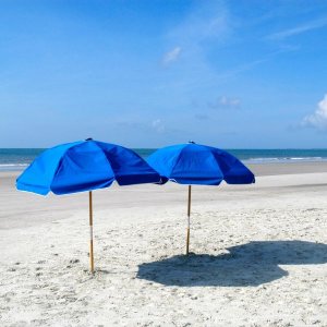 two blue beach umbrellas with shade