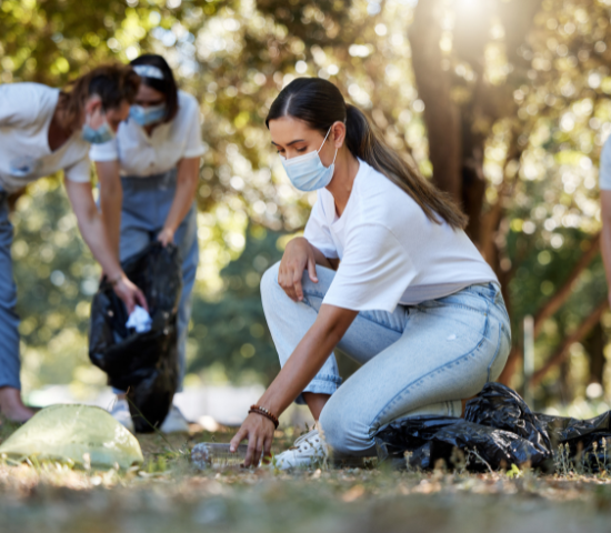Woman wearing mask during an outdoor cleanup