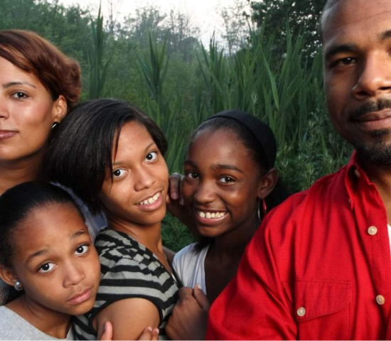 Father, mother, and three kids outdoors