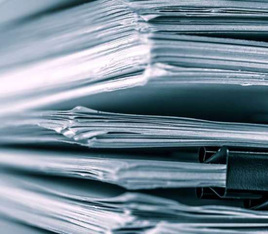 Stack of papers separated by clips