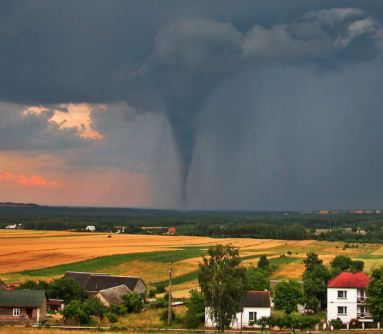Tornado over a field seen from a distance