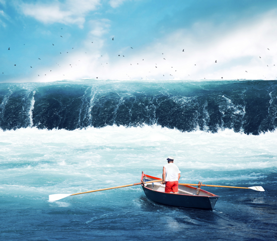 Man in small boat facing tsunami