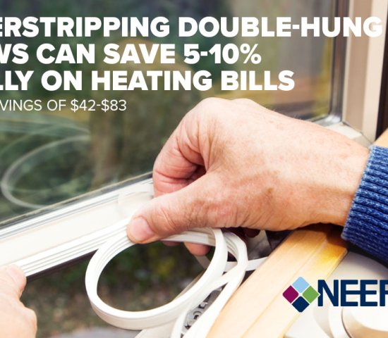 Close up of hand applying weatherstripping to a window