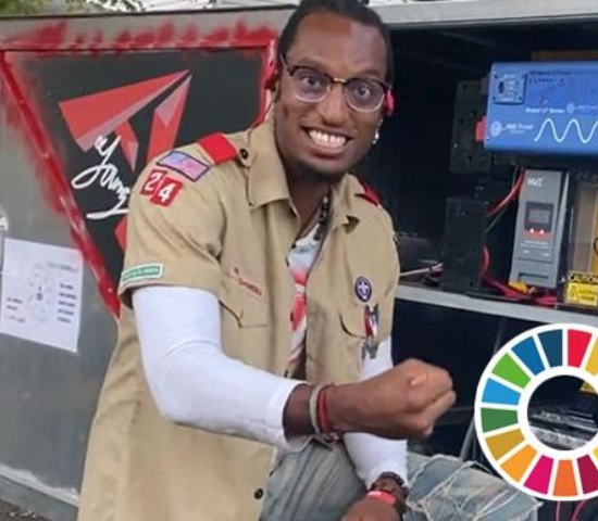 AY Young in front of his solar powered vehicle