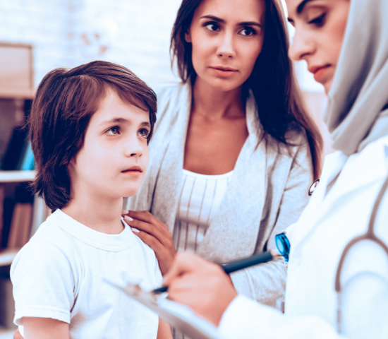 Mother with Son at Arabic Doctor's Appointment By VadimGuzhva