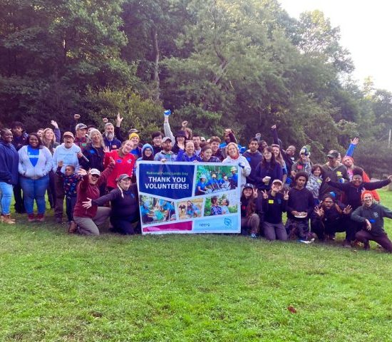 a group of volunteers poses for a photo after a successful national public lands day event