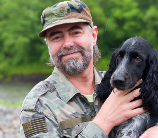 Veteran with his dog outdoors