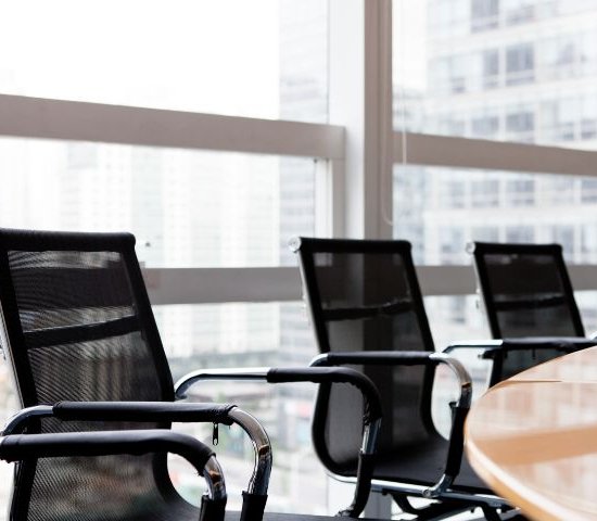 chairs around a table in a board room
