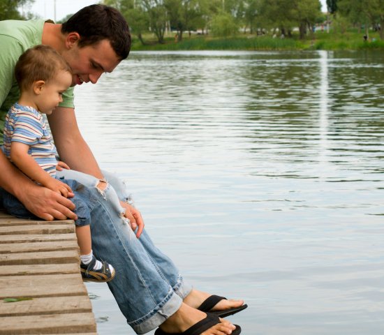 Father and son at the pond