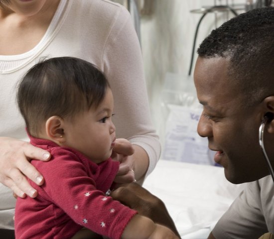 Health care professional with child and her mother